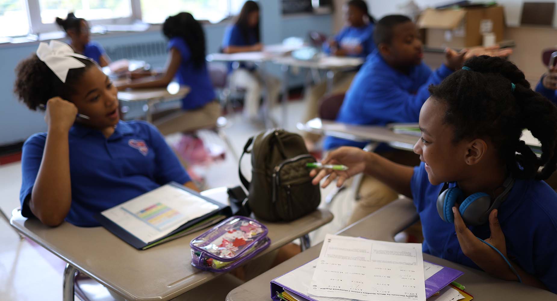 Teacher helping student